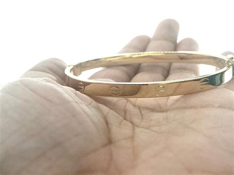 gold screw bangle